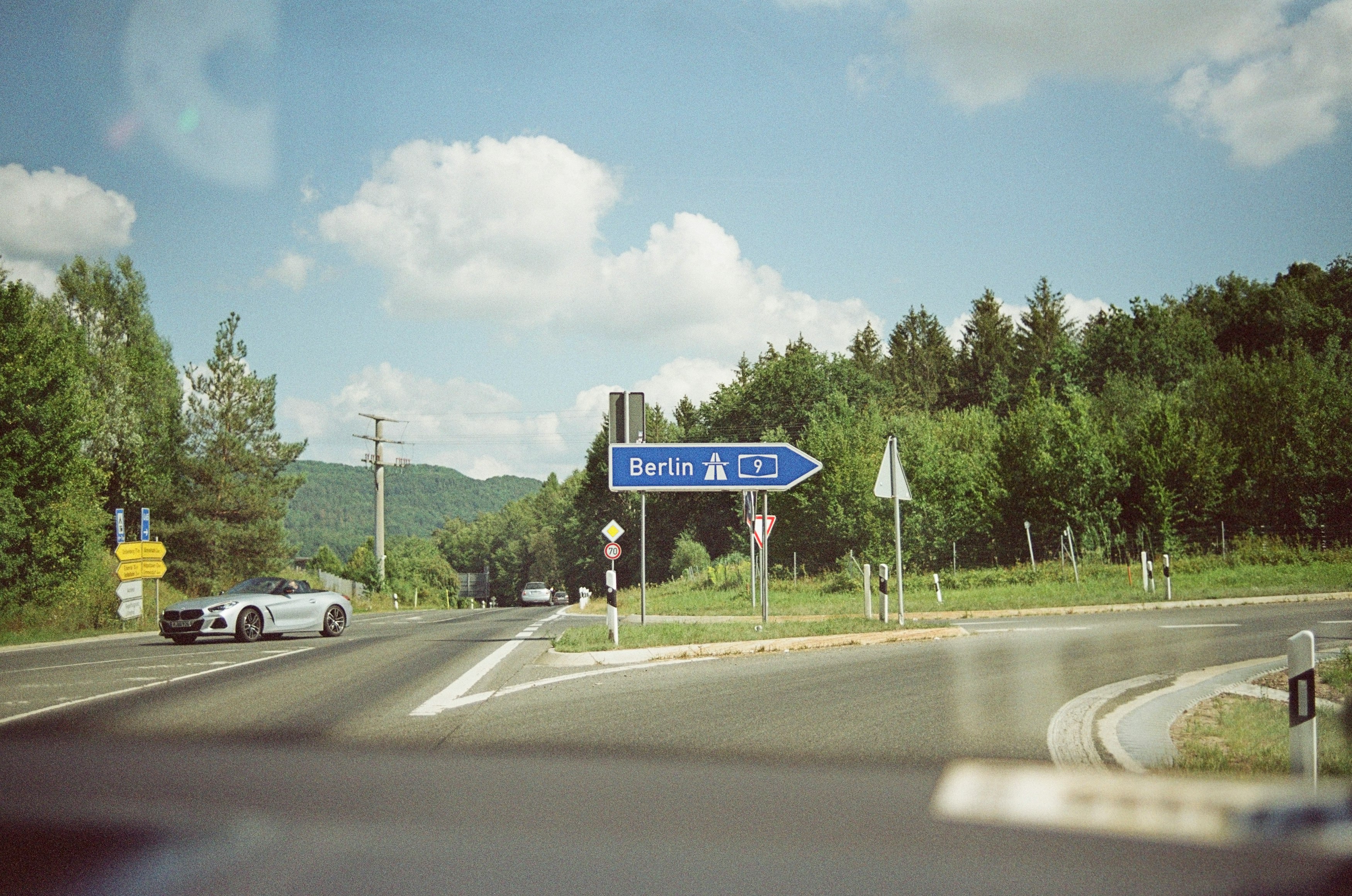 white car on road during daytime